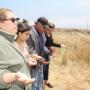 Tribal Treasurer Denise Espinosa, left, prays with other Amah Mutsun members.