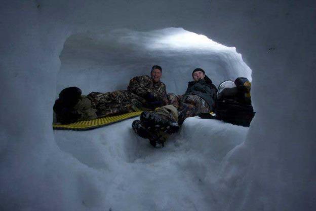 Winter adventurers learn to build cozy (and warm!) snow caves.