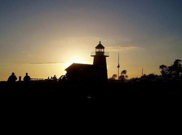 The Lighthouse soaks in it's last rays of the day. Photo by Jun on Flickr. 